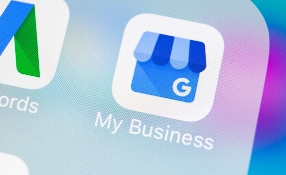 Close-up of a smartphone screen displaying the Google My Business app icon among other apps.