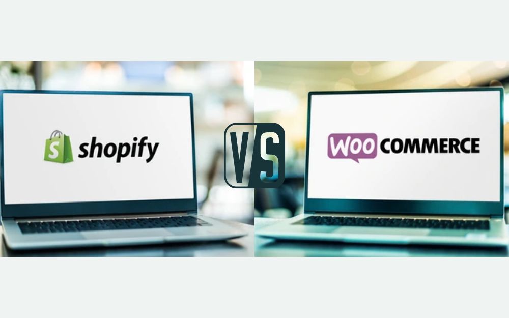 Comparison image featuring two laptops side by side. The left laptop screen displays the Shopify logo, and the right laptop screen shows the WooCommerce logo, with a 'VS' symbol in the center, representing a comparison between the two e-commerce platforms.